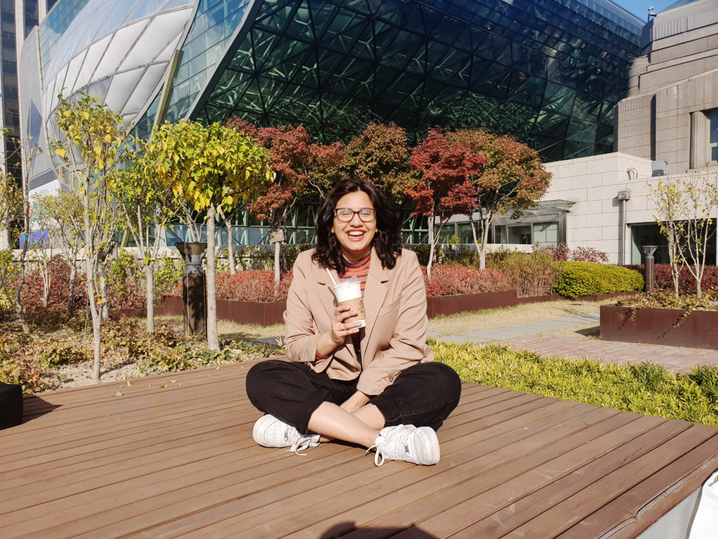 Smiling woman sitting on a bench